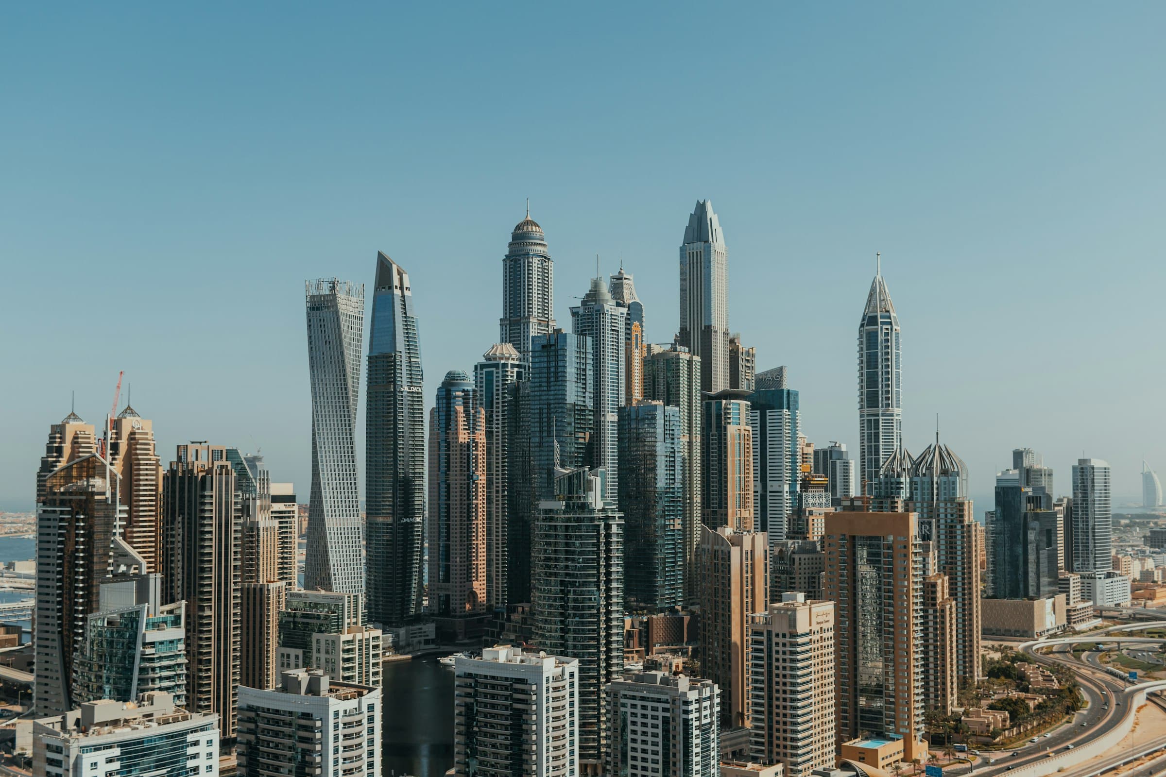 Dubai Marina towers under a clear blue sky